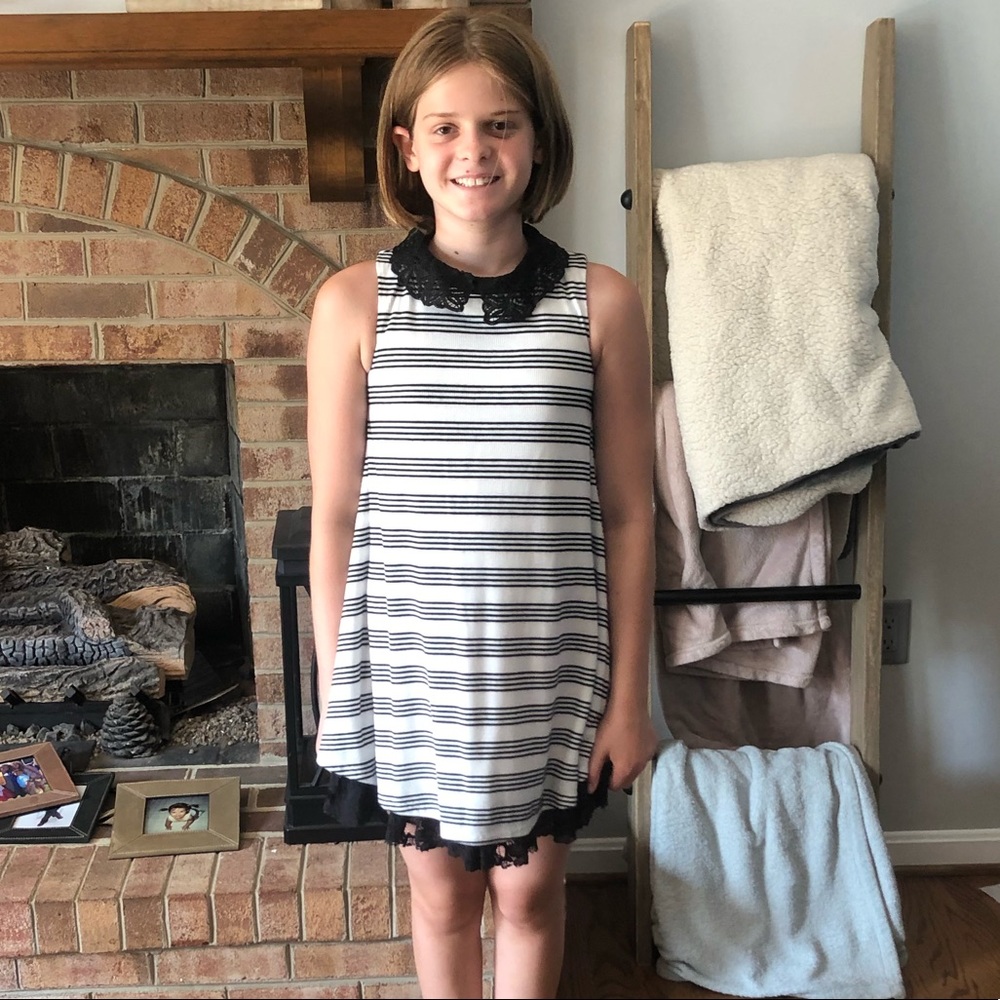 Girl’s cream and black sleeveless dress